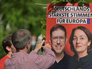 Volunteers mount a placard of SPD party on the day of a protest for democracy and against violence on Matthias Ecke, a member of the European Parliament, in Dresden, Germany, May 5, 2024. REUTERS/Matthias Rietschel 