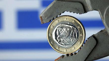 Griechenland in der Klemme: Im März droht die Zahlungsunfähigkeit. Der Verhandlungen um einen Schuldenschnitt mit den privaten Gläubigern kommen indessen nicht voran.