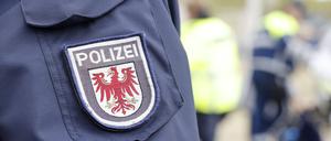 Wappen der Polizei Brandenburg an der Polizeiuniform.
