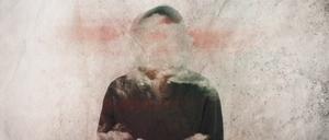 A mental health concept. Of a man with his head covered in clouds.  With a grunge, artistic edit                 