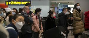 Flugreisende in Peking