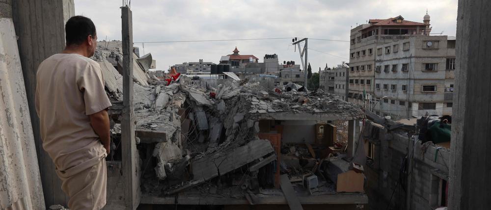 A Palestinian looks at the damage to buildings after Israeli bombardment in Rafah in the southern Gaza Strip, on April 29,